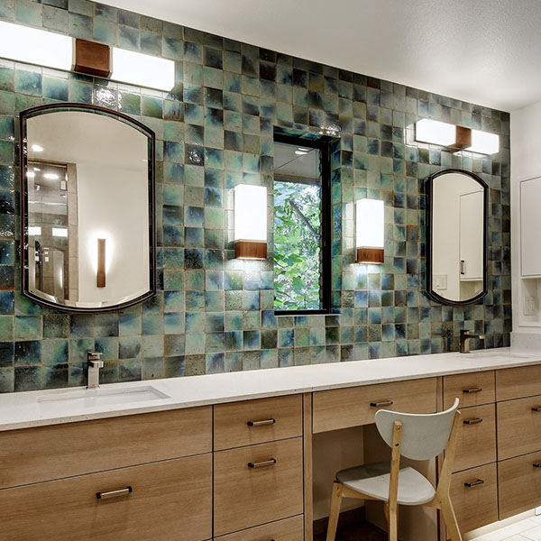 Double mirror bathroom with green decor